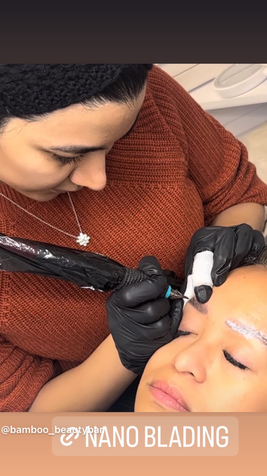 Goli performing a nano brow treatment